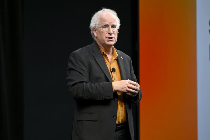 Internet Archive founder Brewster Kahle speaks onstage in 2022 in New York City. He said a cyberattack on the nonprofit, which advocates for universal access to all knowledge, affected more than 31 million of its users.