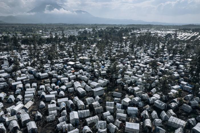 An aerial photograph from 2023 of the Rusayo camp for internally displaced people on the outskirts of Goma in the East of the Democratic Republic of Congo. Hundreds of thousands of Congolese have found refuge around Goma after fleeing fighting further north. Two new reports document a 'staggering' increase in rapes over the past year.