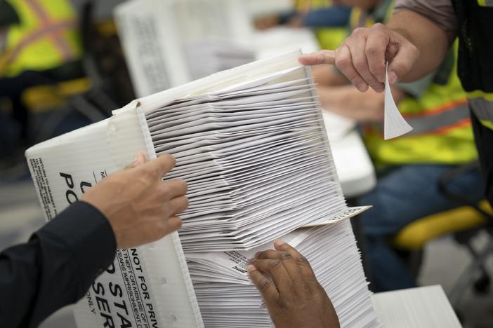 Workers at the Wake County Board of Elections prepare to mail absentee ballots in September in Raleigh, N.C.