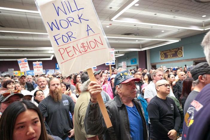 Terry Muriekes, a tool-storage worker at Boeing's factory in Everett, Wash. for 38 years, holds a sign during a strike rally last week.