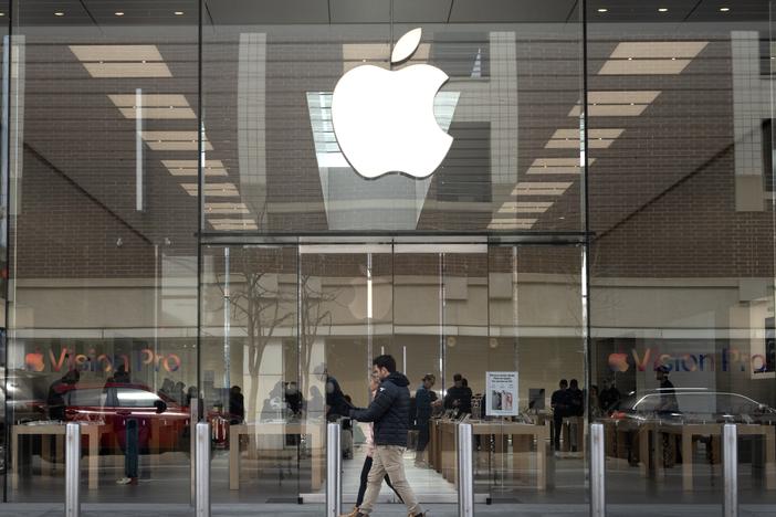 The Consumer Finance Protection Bureau has fined Apple and Goldman Sachs $89 million. Pictured is the Apple logo hanging in front of an Apple store in Chicago in March.
