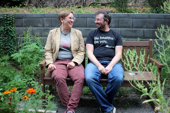 Dr. Kelsey Leonardsmith (left) with colleague Dylan Flunker in the garden of Family Tree Clinic in Minneapolis. The two run a program to train more doctors and nurses in the region to be able to provide gender affirming care, which is legal in Minnesota, but banned for youth in dozens of states around the country.