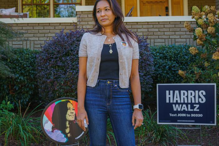 Tahmida Shamsuddin stands for a portrait outside of her home in Atlanta. Knocking on doors of strangers to talk about the election can be anxiety-inducing, she said.