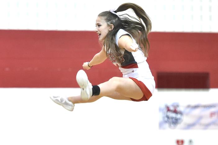 Fleetwood High School cheerleader Samantha Colelli, 17, a senior at Fleetwood, does a basket during halftime at a game in 2017. As cheerleading has become more ambitious over the last decade, it's also become riskier warn pediatricians.