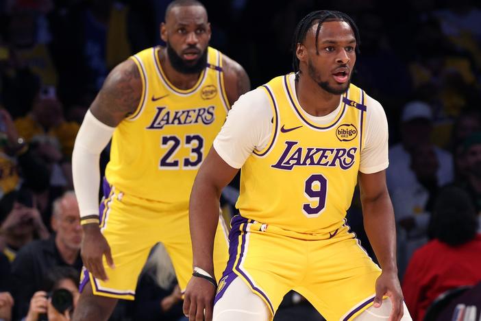 LeBron James, left, and Bronny James of the Lakers play during the second quarter against the Minnesota Timberwolves in Los Angeles on Tuesday.