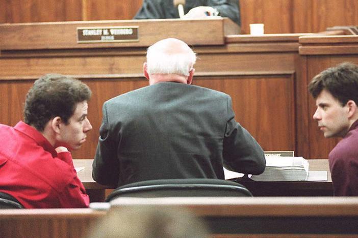 Erik (left) and Lyle Menendez talking in a Los Angeles courtroom on Feb. 2, 1995.