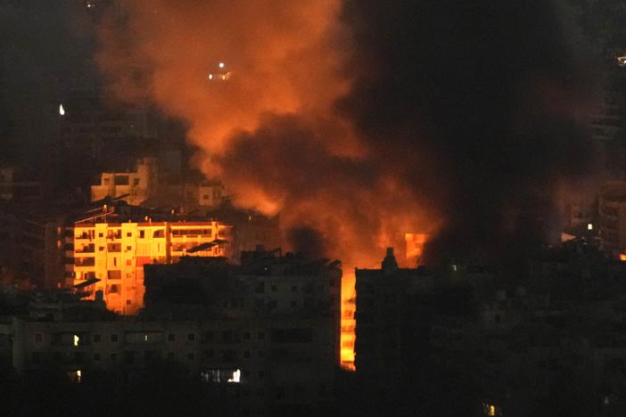 Flame and smoke rises from buildings hit by Israeli airstrikes on Dahiyeh, in the southern suburb of Beirut, Lebanon, early Sunday, Oct. 27, 2024.