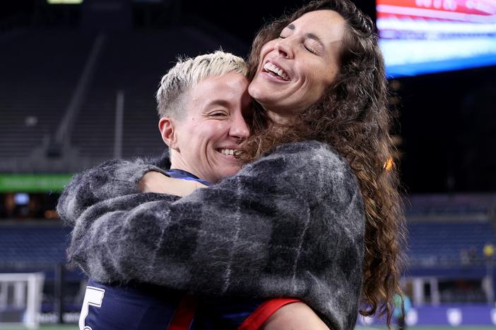 Megan Rapinoe hugs her partner Sue Bird after her last home regular-season NWSL match at Lumen Field on October 06, 2023 in Seattle, Washington