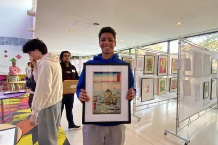 University of Chicago student Rudra Patel happily shows off the work of famed artist Ando Hiroshige that he'll get to display in his dorm room for one year.  Hiroshige was a master of Japanese woodblock printing whose work focused on landscapes and everyday life in Edo-period Japan.