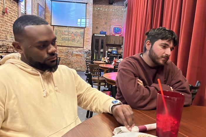 Adrian Consonery, Jr., and Brian Ramirez were part of a group of grassroots organizers that NPR met with at Manuel's Tavern in Atlanta on Oct. 22, 2024.