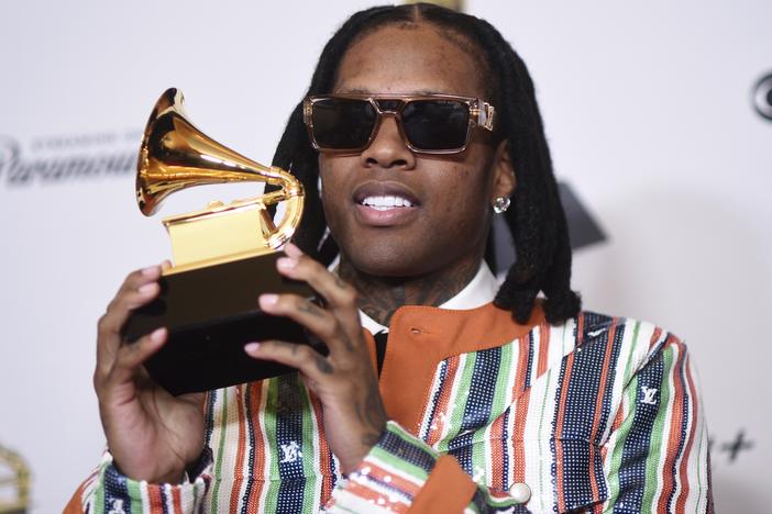 Lil Durk poses in the press room with the award for best melodic rap performance for "All My Life" by Lil Durk featuring J. Cole during the 66th annual Grammy Awards on Feb. 4 in Los Angeles.
