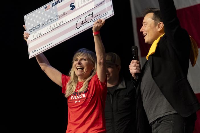 SpaceX and Tesla founder Elon Musk awarded Kristine Fishell with a $1 million check on Oct. 20. The legality of these cash prizes has been called into question.