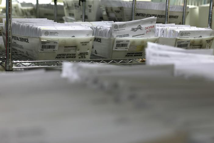 Trays of mail in ballots are stacked at the Santa Clara County Registrar of Voters office on Oct. 21, 2024 in San Jose, Calif.