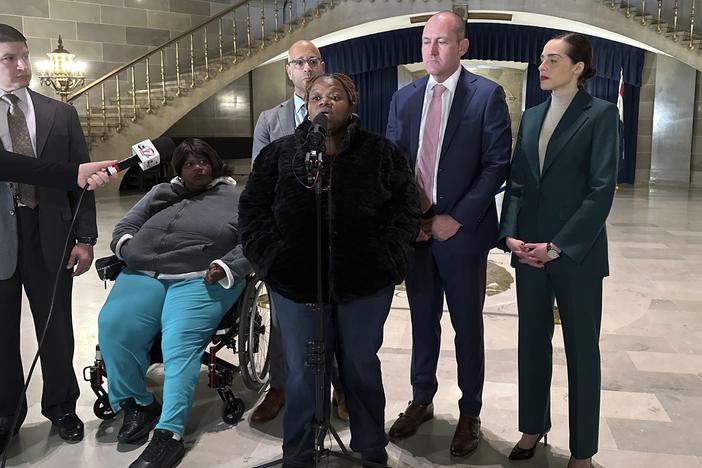 Oriel Moore describes her life without her brother, Othel Moore Jr., to reporters Dec. 19, 2023, at the Missouri Capitol in Jefferson City, Mo.