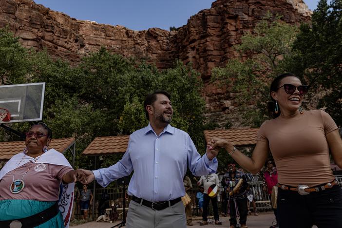 Arizona Democratic Rep. Ruben Gallego (center) joins community members in a traditional dance at the Supai Tribe village in the Grand Canyon on Oct. 14.