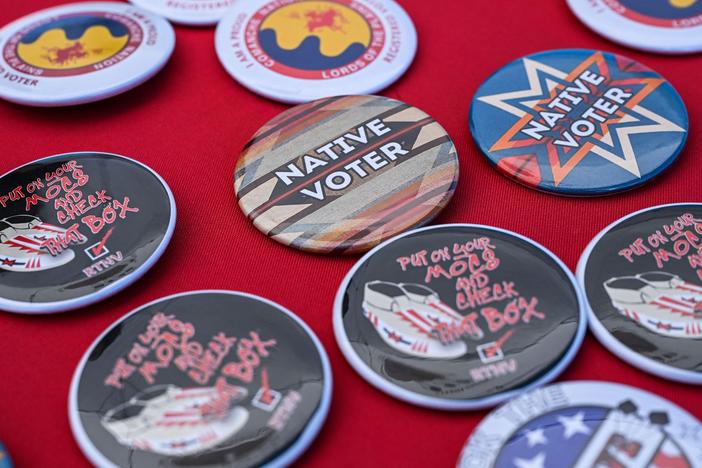 Pins are pictured at a counter during a cultural meeting at the Comanche Nation fairgrounds in Lawton, Okla., in September 2023.