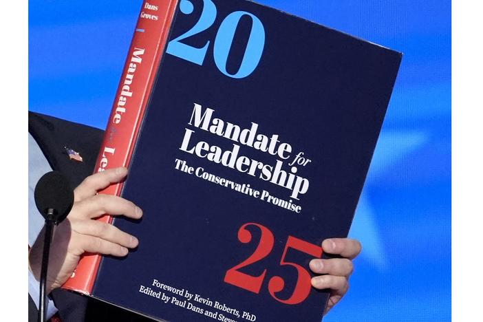 A copy of Project 2025 is held during the Democratic National Convention in August.
