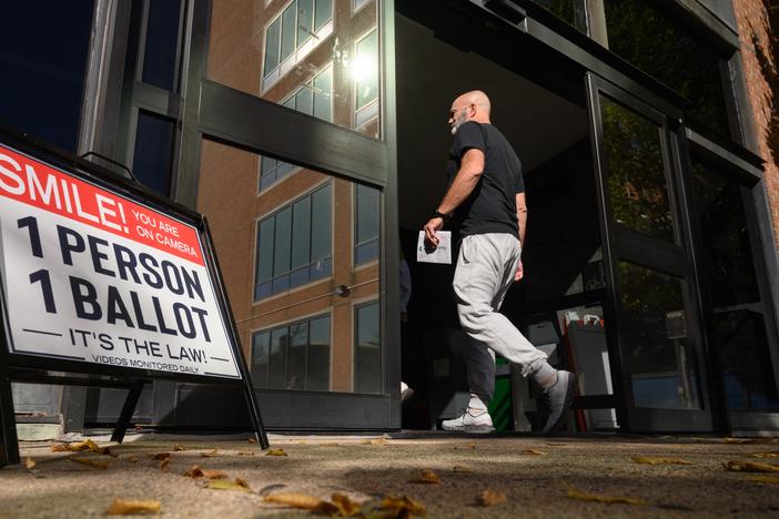 A voter enters the Bucks County Administration building in Doylestown, Pa. on Oct. 31, 2024.