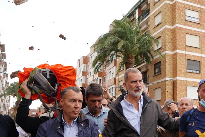 King Felipe VI of Spain is heckled by angry residents who throw mud and objects during his visit to Paiporta, in the region of Valencia, eastern Spain, on November 3, 2024, in the aftermath of devastating deadly floods.