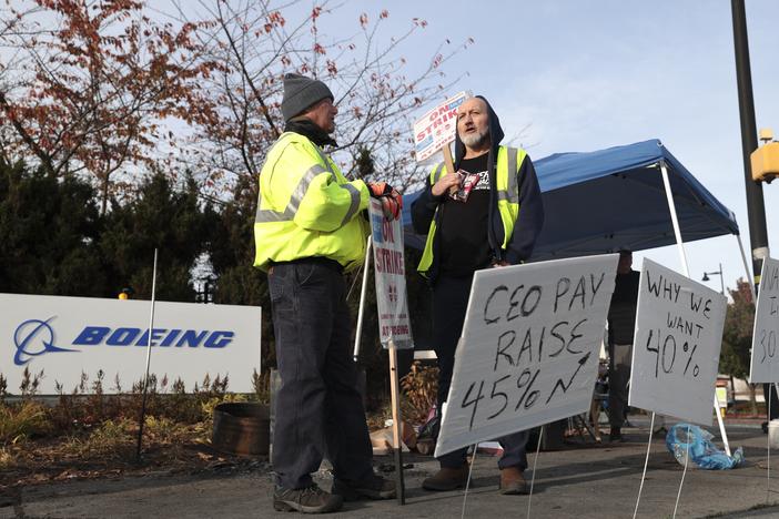 Striking machinists at Boeing picket outside the company's Renton Production Facility in Washington. Some 33,000 workers walked off the job in September demanding higher pay and better retirement benefits. Union members have voted down two previous contract offers from Boeing ahead of Monday's vote.