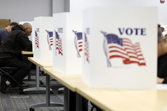 People cast ballots in Howell, Mich., on Sunday.