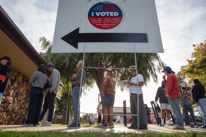 People stand in line to vote at Joslyn Park vote center in Santa Monica, California on Tuesday.