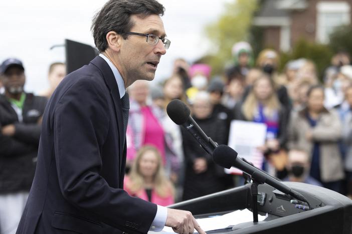 Washington state Attorney General Bob Ferguson speaks to media and people gathered at Kerry Park in 2022.