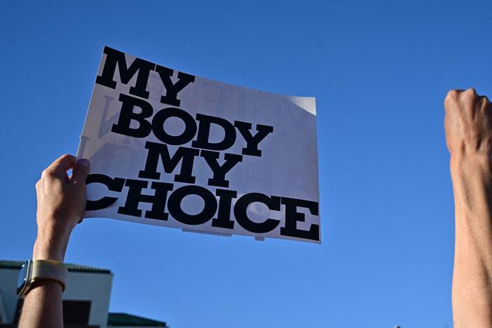 Demonstrators rally in Scottsdale, Arizona.
