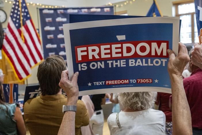 Signs supporting the abortion rights amendment are displayed during a rally on September 5, 2024 in Bozeman, Mont.
