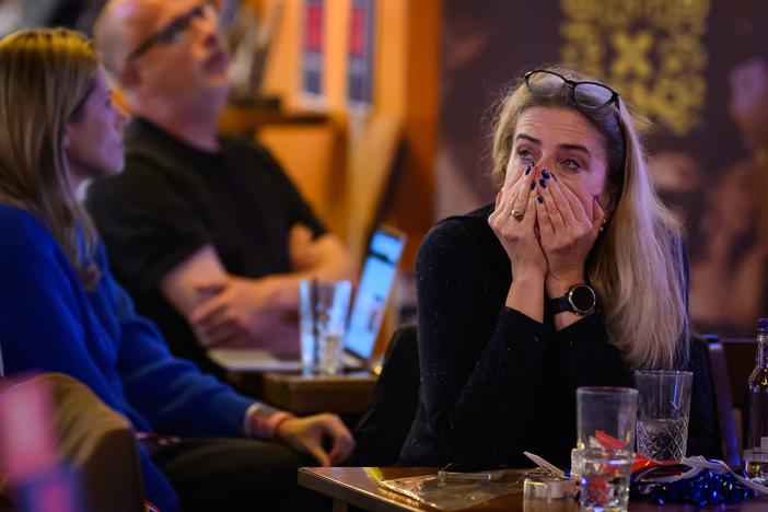 Supporters of U.S. Vice President Kamala Harris react as results are displayed during a Democrats Abroad election party on Wednesday in London, England.