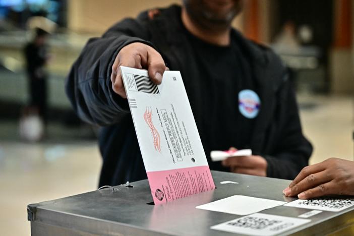 People vote at a polling station at Meadows Mall in Las Vegas on Tuesday. Nevada was one of several states to vote down election reform efforts.