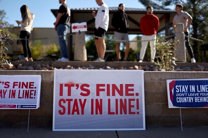 Voters wait in line to cast their ballots at a polling place in Scottsdale, Arizona on Nov. 5.