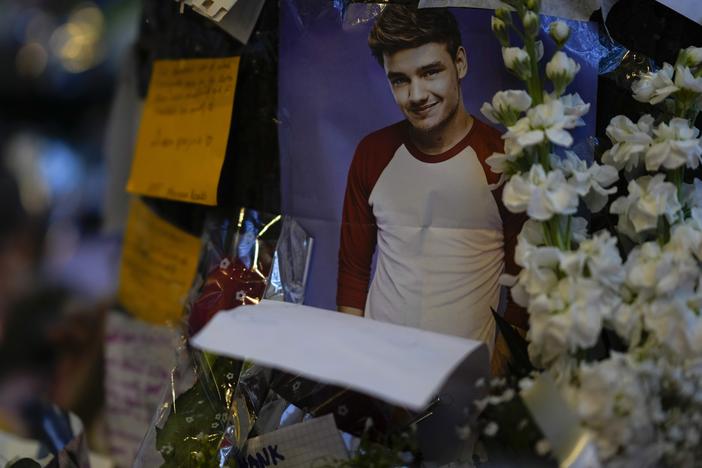 A picture of former One Direction singer Liam Payne adorns a memorial outside the hotel where he was found dead after falling from a balcony in Buenos Aires, Argentina, Thursday, Oct. 17, 2024.
