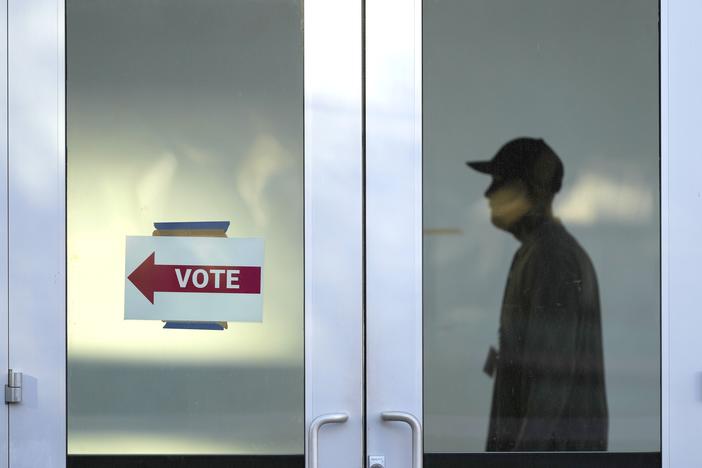 A polling place at the Arizona State University campus, Tuesday, in Phoenix, Ariz. Polling finds that three out of ten voters in Arizona who supported an abortion rights ballot measure also voted for Trump.
