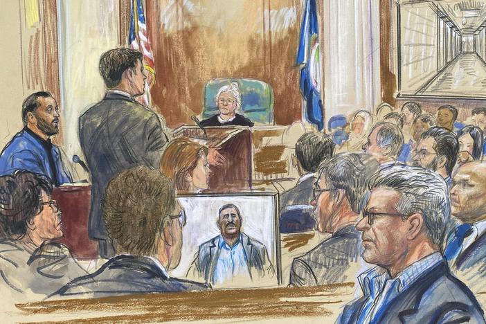 This courtroom sketch depicts a former detainee at Abu Ghraib prison, Salah Al-Ejaili (foreground with glasses), at the trial of CACI, a Virginia-based military contractor who is accused of contributing to the abuse and torture of detainees at Abu Ghraib, in U.S. District Court in Alexandria, Va., on April 16.