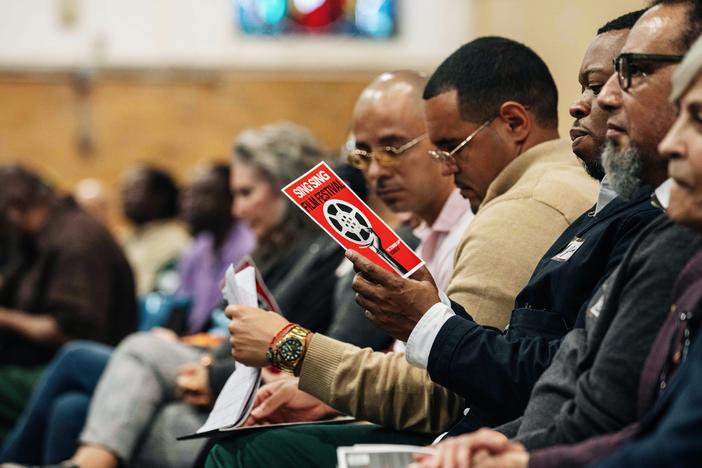 Guests and incarcerated men sit alongside each other at the Sing Sing Correctional Facility's first-ever film festival on Oct. 24.