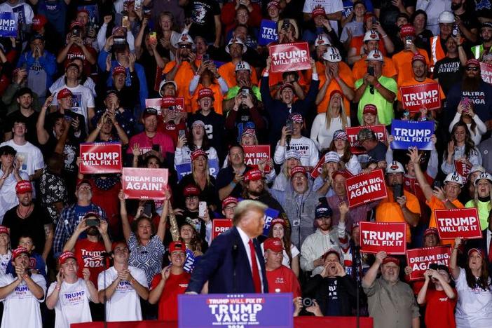 Supporters cheer as President-elect Donald Trump arrives to speak at his last campaign rally at Van Andel Arena in Grand Rapids, Mich., on Nov. 5.