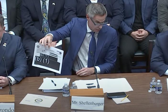Journalist Michael Shellenberger, founder of the Public news outlet, displays redacted reports during a hearing on Capitol Hill Wednesday as he stresses the need for more transparency over UAP investigations.