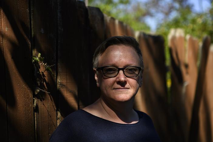 Natalie Donaldson, an Army veteran, poses for a portrait at her home in Tulsa, Okla. A COVID assistance program that was supposed to help her avoid foreclosure ended up increasing her mortgage payments by 50% every month.