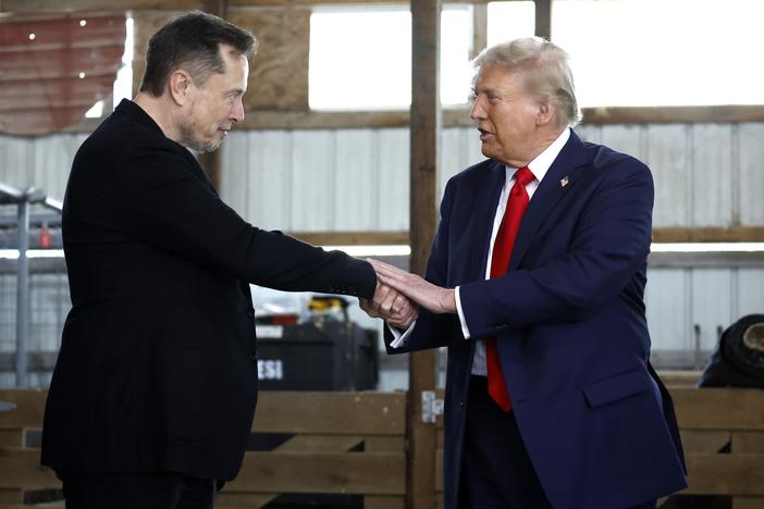 President-elect Trump shakes hands with Elon Musk at a campaign stop in Butler, Pa., on October 5, 2024. Trump has named Musk and former presidential hopeful Vivek Ramaswamy co-leaders of a new commission called the "Department of Government Efficiency," which will advise and guide Trump in his quest to "dismantle government bureaucracy."
