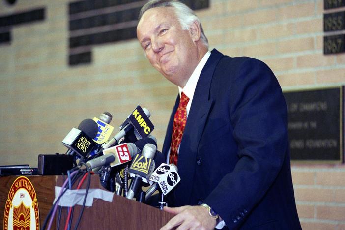 Former head coach of the Los Angeles Rams John Robinson addresses the media in Los Angeles, Jan. 3, 1992.