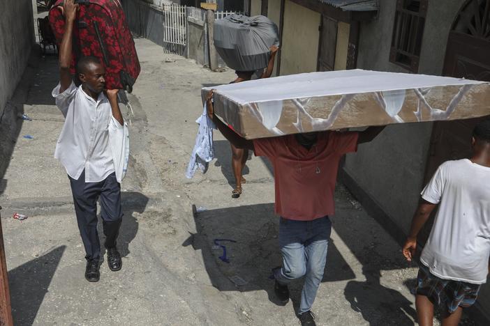Residents flee their homes to escape gang violence in the Nazon neighborhood of Port-au-Prince, Haiti on Thursday.