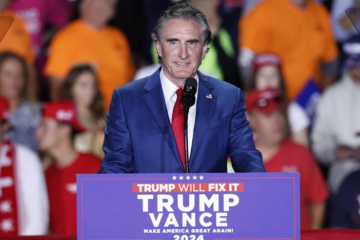 North Dakota Gov. Doug Burgum, pictured at a campaign rally early this month in Michigan, would play a key role in pushing President-leect Donald Trump's agenda to increase oil, gas and coal production on public lands if he is confirmed as secretary of the Interior Department.