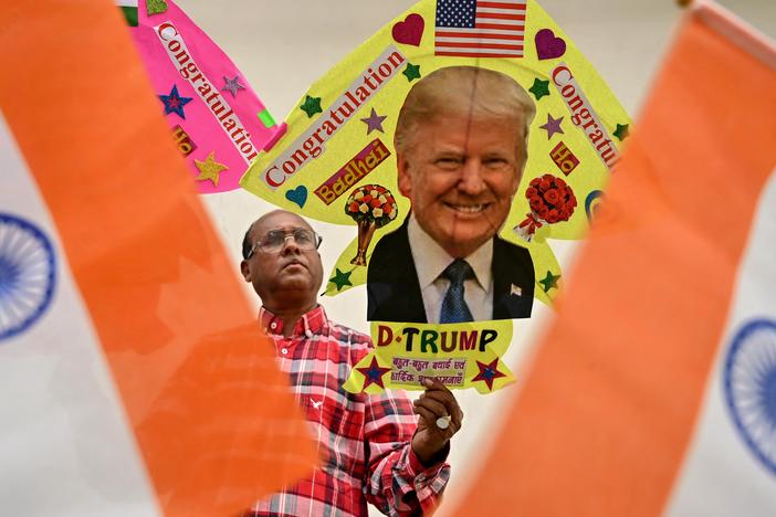 A kite maker in Amritsar, India, displays a kite with an image of Donald Trump on Nov. 6.