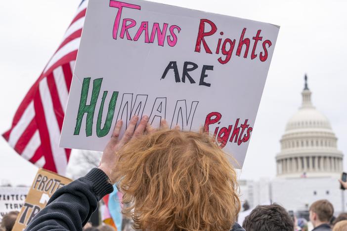 People attend a rally as part of a Transgender Day of Visibility on March 31, 2023, by the U.S. Capitol in Washington.