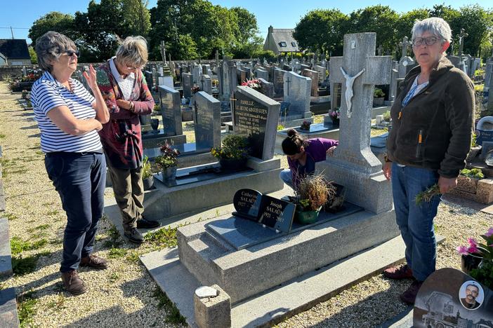 From left: Michelle Salaün, Jeannine Plassard and Marie-Annick Gouez, the daughters of Catherine Tournellec Salaün, stand at their mother's grave in Plabennec, in France's Brittany region, in June.