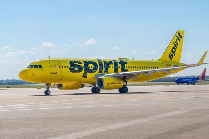 A Spirit Airlines plane prepares to depart from the Austin-Bergstrom International Airport. The low-cost carrier plans to keep flying as it files for Chapter 11 bankruptcy protection.