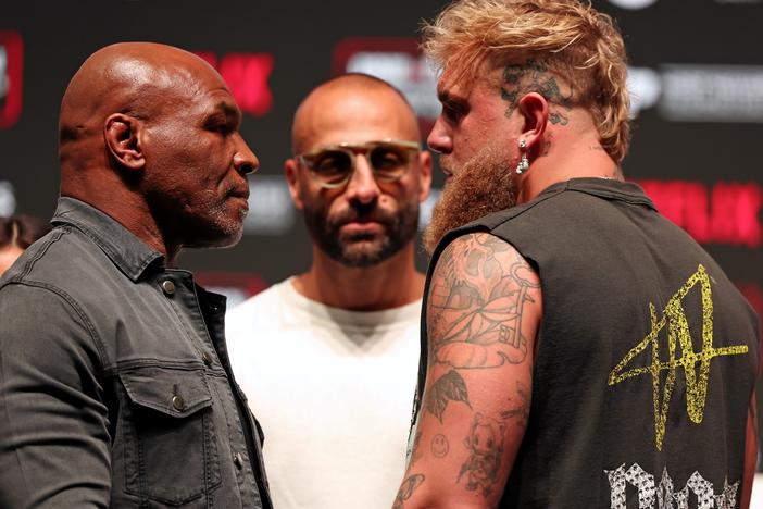 Mike Tyson, Jake Paul's manager Nakisa Bidarian, and Jake Paul at a press conference this week ahead of Friday's fight.