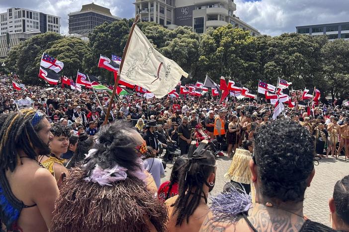 Indigenous Māori gather outside Parliament in Wellington, New Zealand on Tuesday.