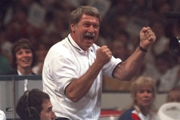 Bela Karolyi reacts with joy as his gymnastics student Kerri Strug finishes a routine on the balance beam during the U.S. Olympic Trials in gymnastics, on June 30, 1996, in Boston.